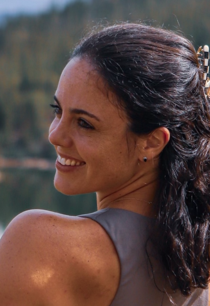 Staff member Robin Jump smiling over her shoulder.